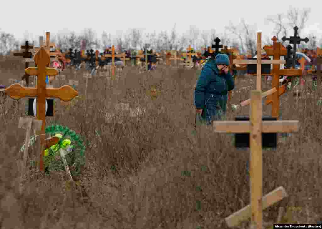 Orfinyak at her granddaughter’s grave. According to Orfinyak, 10 people were killed in the mortar explosion, including three children. Veronika, “was thrown against the entrance door. She was wounded and died while we were taking her to the hospital,” the bereaved grandmother told Reuters, adding, “our son was killed immediately." 