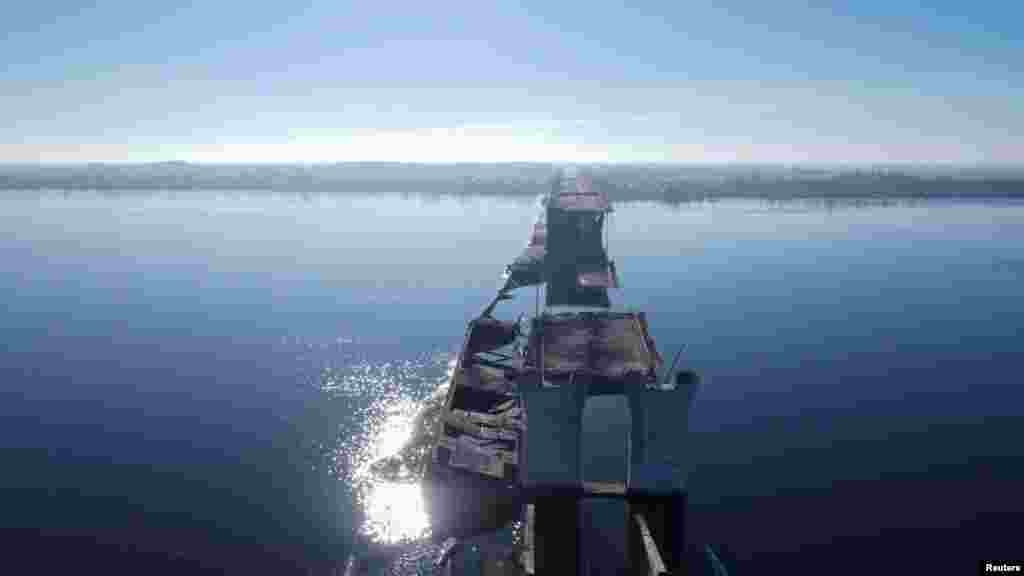 A view of the destroyed Antonivskiy Bridge over the Dnieper River, which was rendered impassable over the summer due to repeated rocket and missile strikes. Russia's withdrawal from Kherson marks another victory for Kyiv as the front lines on the battlefield continue to be redrawn. 