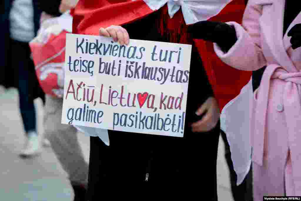 Another sign reads, "Everyone has the right to be heard. Thank you, Lithuania, for allowing us to be heard." 