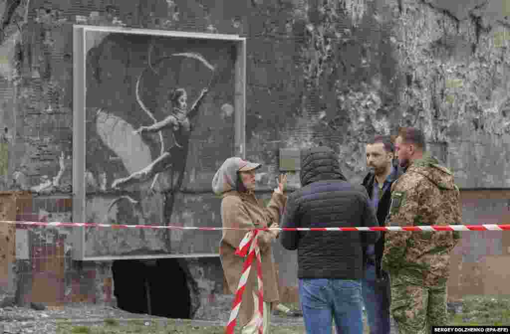 A mural by the elusive British artist Banksy -- showing an injured&nbsp;gymnast in a neck collar performing a ribbon routine -- painted on one of Irpin&#39;s shattered residential buildings will be preserved. City officials last year made Banksy an honorary citizen for&nbsp;&quot;drawing the world community&#39;s attention to the scale of the destruction of Irpin.&quot;