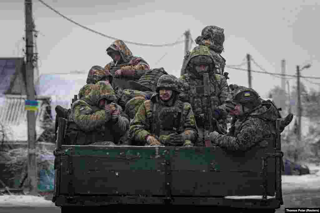 Ukrainian soldiers ride aboard a truck in the Donetsk region. "The volumes that we have today are not sufficient for us today, given our needs. So, we're redistributing it. We're replanning tasks that we had set for ourselves and making them smaller because we need to provide for them," General Tarnavskiy said, without providing details. 