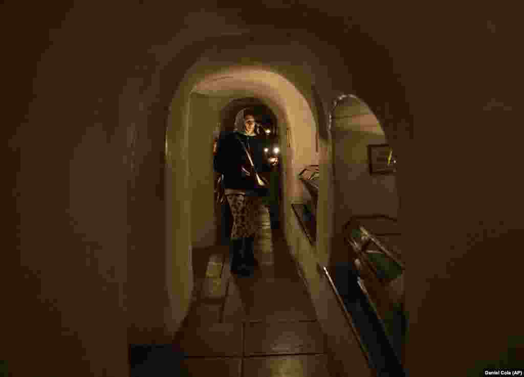 A woman viewing mummified monks in the catacombs of the monastery on February 5, 2023. Passersby who spoke to AFP on March 14 were largely supportive of the ordered eviction, with one saying, &ldquo;If they are pro-Moscow, they&rsquo;re not welcome here.&quot; A monk told the French news agency: &ldquo;Many of the fathers, the monks, simply don&#39;t have anywhere except the lavra. It&#39;s our home. And for us, this [eviction notice] was a bolt from the blue.&quot;
