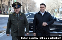 Kyrgyz President Sadyr Japarov (right) and his national security chief, Kamchybek Tashiev, his de facto co-ruler.