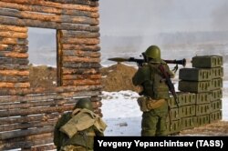 Russian soldiers called up as part of the military mobilization take part in a military exercise at a shooting range in Russia.