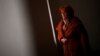 Nusreta Sivac, a Bosnian War rape victim, looks through a window in one of several camps where she was detained, in Trnopolje near Prijedor, Bosnia-Herzegovina. (file photo)