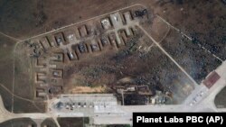 This satellite image provided by Planet Labs PBC shows destroyed Russian aircraft at the Saky Air Base after explosions on August 9.
