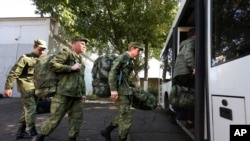Russian recruits take a bus near a military recruitment center in Krasnodar on September 25. 
