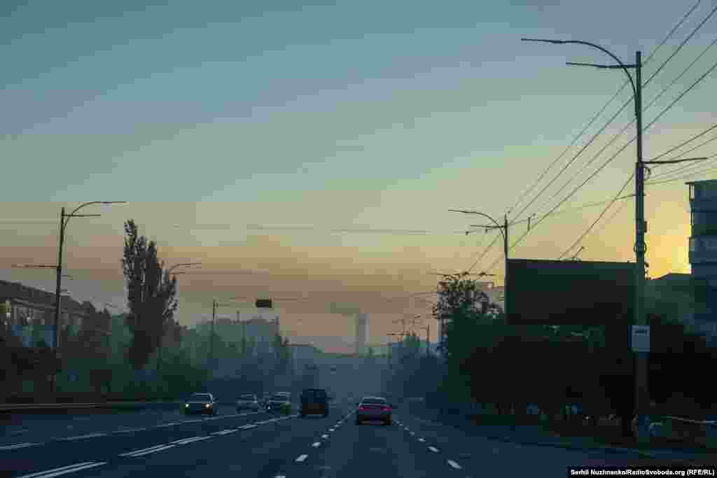 Kyiv residents awoke on August 28 to a hazy dawn as smoke from the fires sparked by the Russian attack drifted in the morning light.
