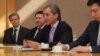 Moldova's deputy prime minister, Iurie Leanca (center), holds a hard drive containing a Holocaust-era archive of documents at the U.S. Holocaust Memorial Museum in Washington.