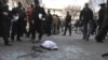Policemen gather evidence at a bomb blast site in Tehran, which killed nuclear scientist Mostafa Ahmadi Roshan on January 11. 