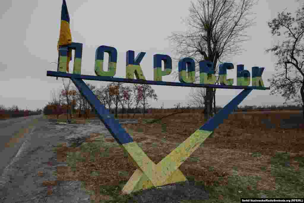 A road sign for Pokrovsk on the outskirts of the city. We leave Pokrovsk with heavy hearts. It seems likely we could return soon to the city to film street battles. We remember the words of shopkeeper Svitlana Yaroslavovna: "I hold on to my faith in God, and the armed forces of Ukraine, this is where I place my hope."