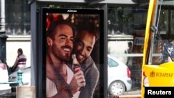 An advertisement promoting gay acceptance, which prompted a political backlash, is seen in Budapest in August 2019. 