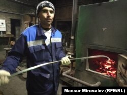 Tajik-born migrant Nazim Soliev at his job as a stoker for a school in Rozhdestveno, Russia