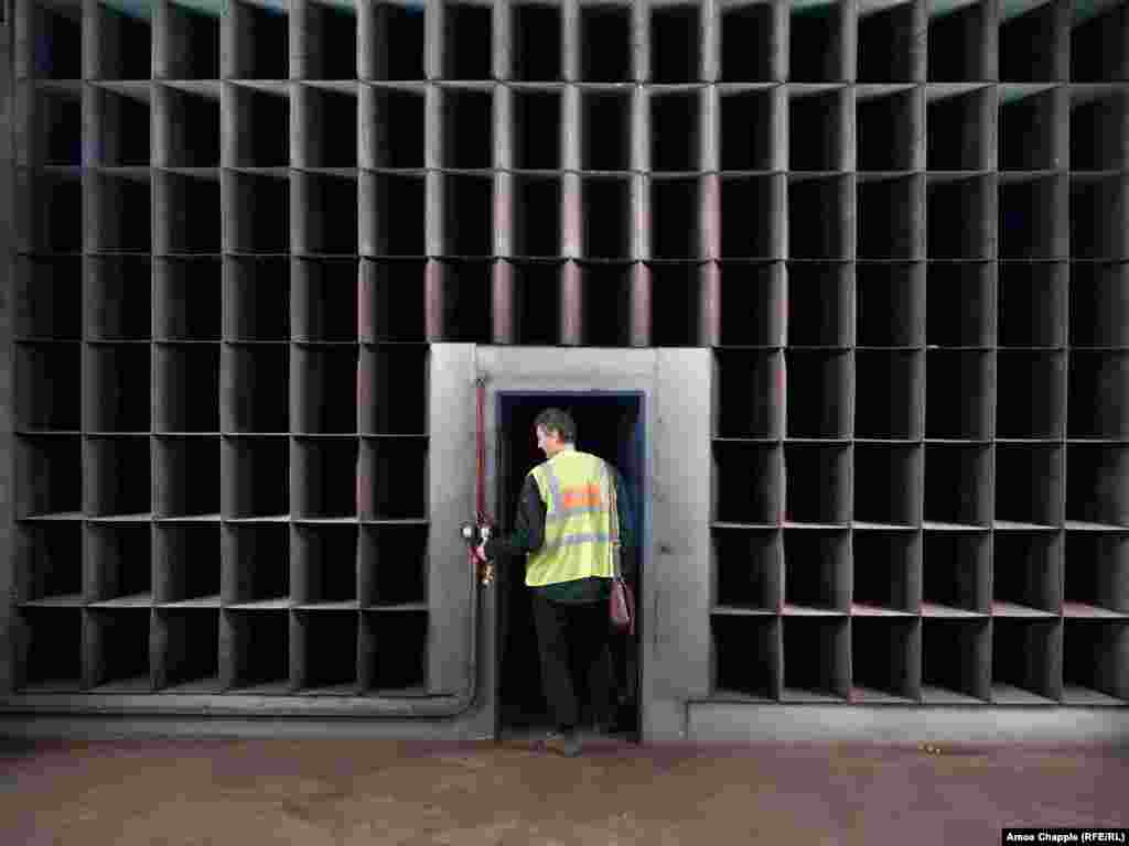 A subway worker walks through a wall of baffles designed to slow airflow within the Prague underground. A spokesperson for the Prague City Transport Company confirmed that with the OSM's limited capacity of less than a quarter of the Czech capital's 1.4 million population, "it cannot be assumed that all residents will be sheltered in the metro" in the event of war. 