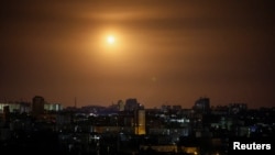 The explosion of a drone is seen in the sky over Kyiv during a massive Russian drone strike on July 31.