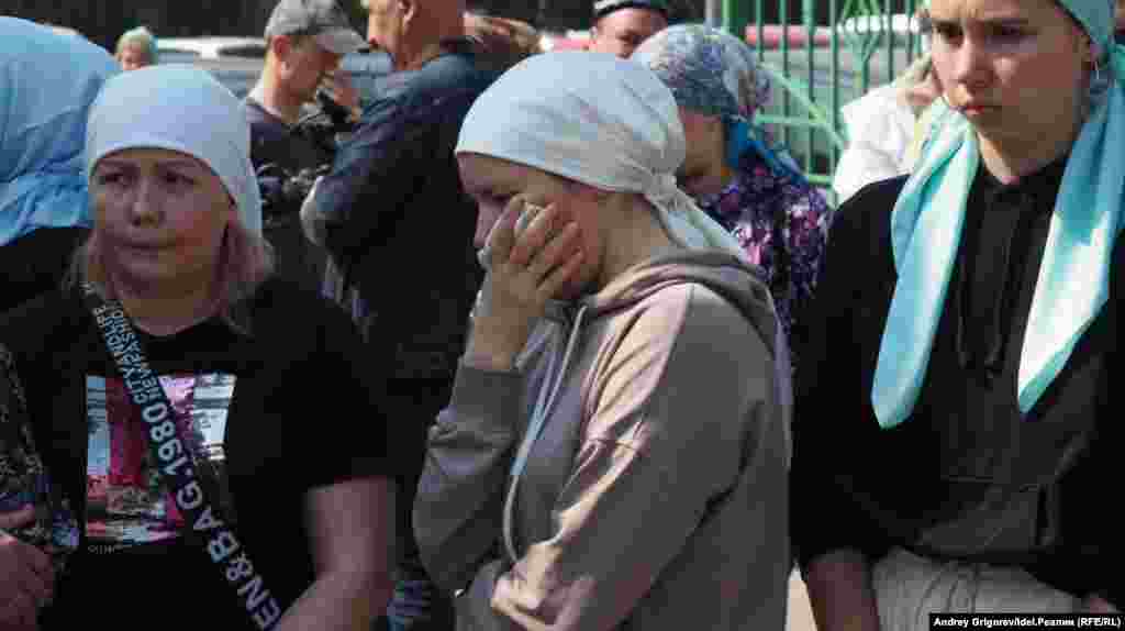 Victims' families react during the students' funeral.