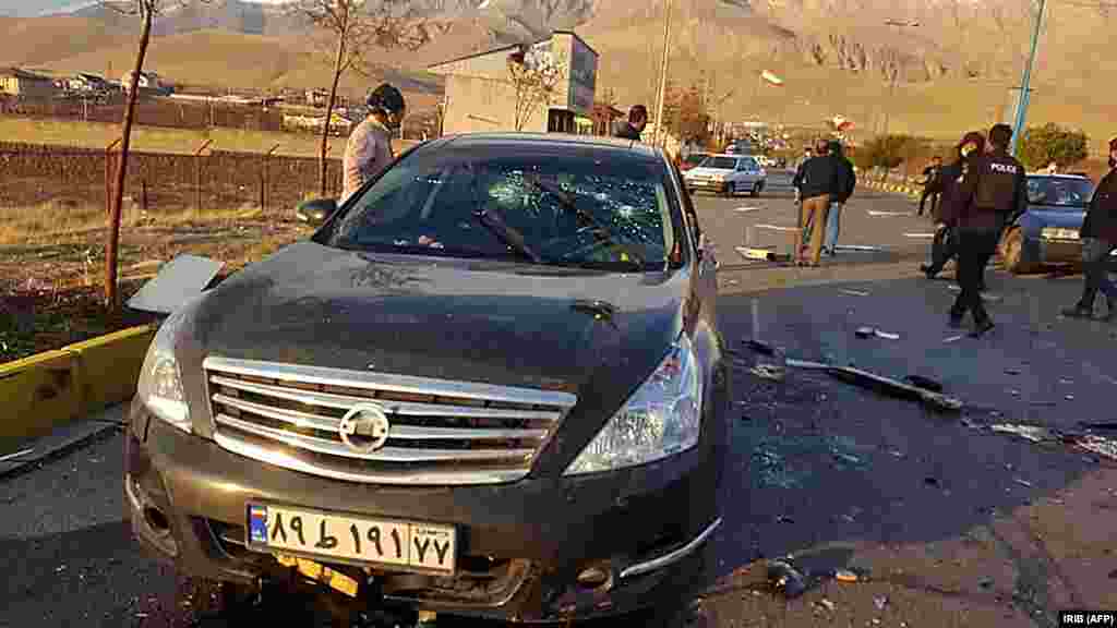 Fakhrizadeh's bullet-riddled car after the lethal attack near Tehran on November 27. Initial reports suggested several gunmen had attacked the physicist's car after detonating a bomb nearby. But Iran has since claimed that remote-controlled "electronic equipment" was used in the attack, and that no assassins were present at the scene. Images released by Iranian state media show a puddle of blood on the road next to the car seen in this photo, and what appears to be the remains of a large explosion littering the road where the physicist was killed. 