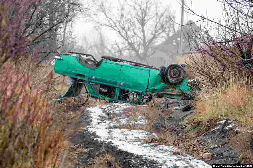 An upturned car on what was once a street in Maryinka, photographed on December 4. 