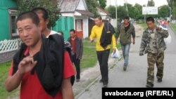 Chinese workers marching to protest unpaid wages. 