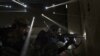 Two Syrian rebels take sniper positions in a heavily contested neighborhood of central Aleppo. Internecine strife has now been raging in the country for 3 1/2 years, killing an estimated 190,000 people. 