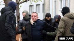 Security Service officers detain Valeriy Shaytanov in Kyiv on April 14.