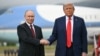 US President Donald Trump greets Russian President Vladimir Putin on the tarmac after they arrived in Anchorage, Alaska, on August 15.