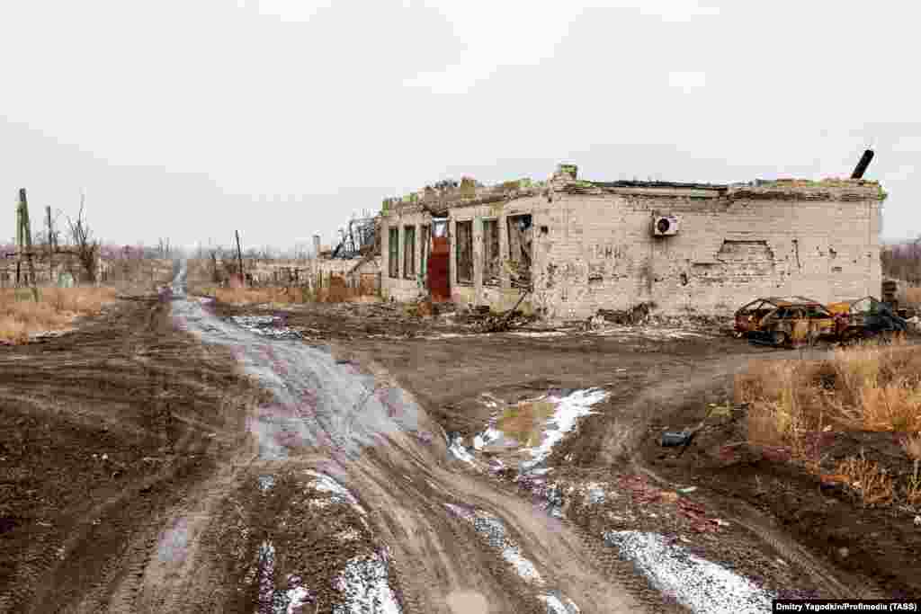 The ruins of a roadside business seen on December 4. Grom says during her many trips to photograph the city, she became close with some of the residents whom she describes as "tenderhearted, kind people who faced severe trials." 