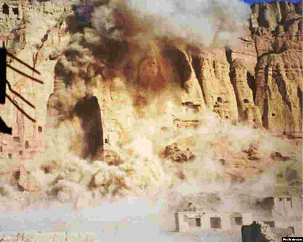 Dynamite charges set by the Taliban destroy one of the Buddhas in March 2001. The Islamic militants had declared the statues to be "false idols" under their interpretation of Islamic law.