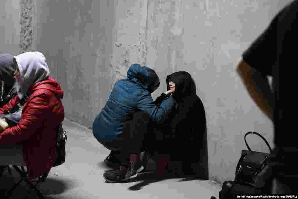 People in Kyiv take shelter amid the overnight strikes that shook the Ukrainian capital.