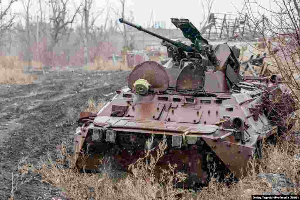 A destroyed armored vehicle on a road in what remains of Maryinka, seen on December 4. Grom says the city was unusually green and "was beautiful in the spring when the fruit trees blossomed." 