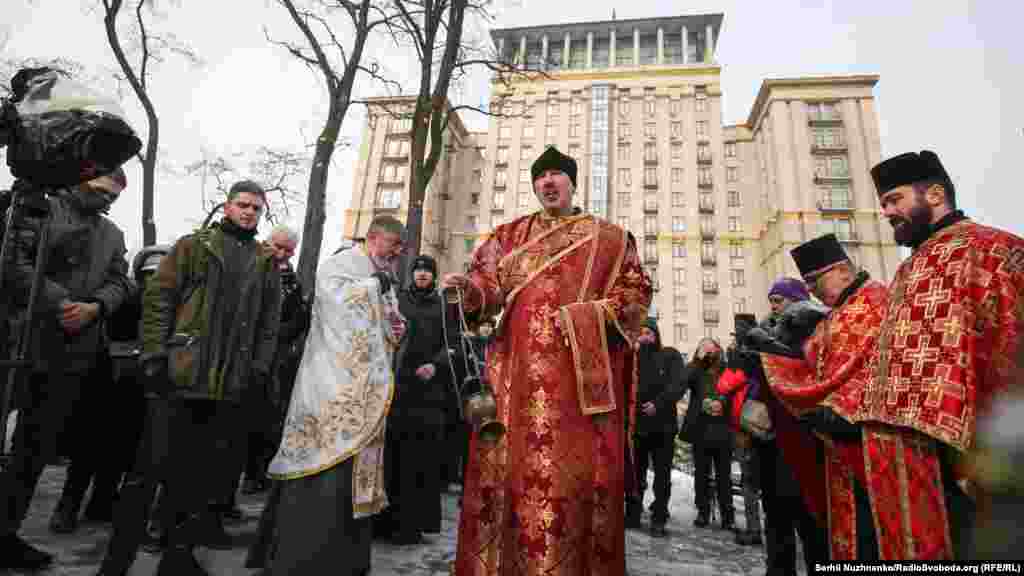 A priest says a prayer in memory of those killed seven years ago. Most of the victims lost their lives between February 18-20, with 49 people dying on February 20.
