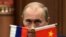 China -- Russian Prime Minister Vladimir Putin pauses during a news conference with China's Premier after a signing ceremony at the Great Hall of the People in Beijing, October 13, 2009