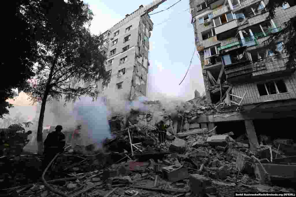 The scene of the impact in Kyiv, where an entire section of an apartment building collapsed after a Russian strike.At least 14 people have been reported killed in the Ukrainian capital as a result of the overnight strikes.