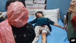 A injured girl who lives in a village near the Line of Control between India and Pakistan receives treatment at a hospital in Indian-controlled Kashmir following shelling by Pakistani forces on May 7. 