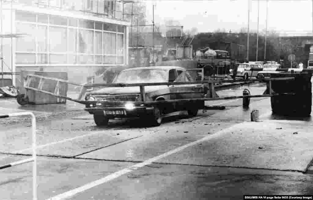 An image from the Stasi archives apparently showing a failed attempt to ram through a border crossing from East Germany in 1982. Thousands of people were able to escape from East Berlin to freedom, but at least 140 were killed in their attempts during the decades the wall stood from 1961 until 1989. 