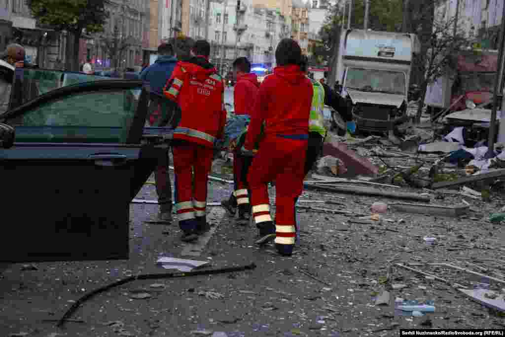Emergency workers struggled to treat wounded people as rescuers searched debris.