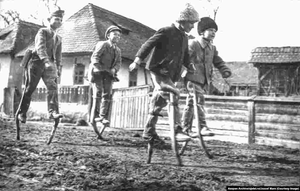This image, of Romanian youngsters walking on stilts, is one of more than 5,000 photos published online in early November from salvaged archives of the Romanian photo journal Uj Elet. 
