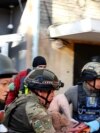 Ukrainian Woman Rescued After Russian Bombing Ukrainian Woman Rescued After Russian Bombing
