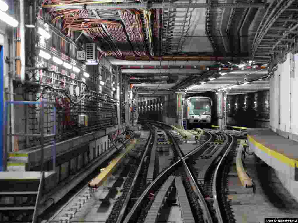 A subway train awaits its morning duties as a blast door is tested nearby. Today, the Prague authorities describe the OSM’s purpose as both “to protect the population against the effects of weapons of mass destruction for a period of 72 hours," and “to isolate sections of the metro in the event of a major flood.”