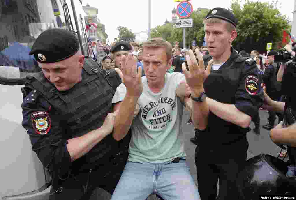 Police detain Navalny during a rally in support of investigative journalist Ivan Golunov, who was detained by police and accused of drug possession on June 12, 2019. 