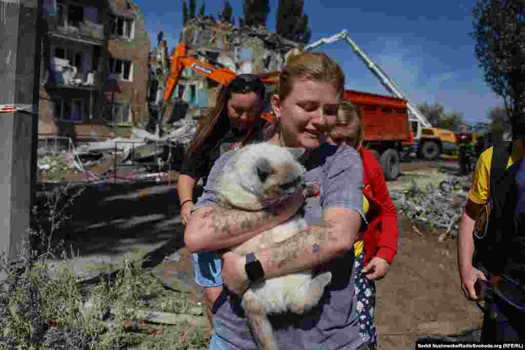 Survivors of the Russian attack left the rubble of their homes with few belongings, some carrying their pets.